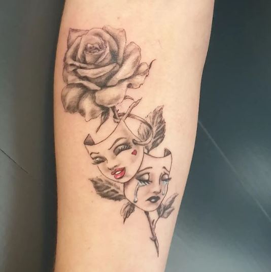 Happy Sad Faces On Rose Stem Tattoo