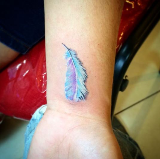 Icy Blue and Purple Feather Wrist Tattoo
