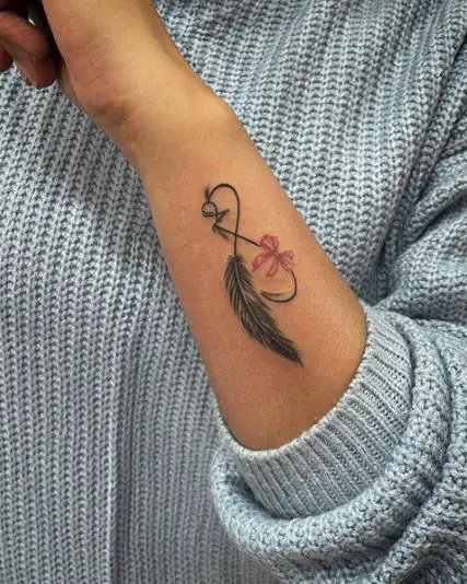 Infinity with feather tattoo piece