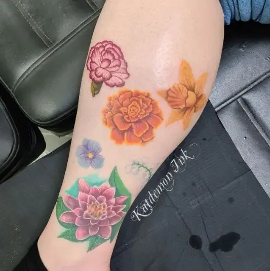 Marigold Carnation and Daffodil Flower Tattoo