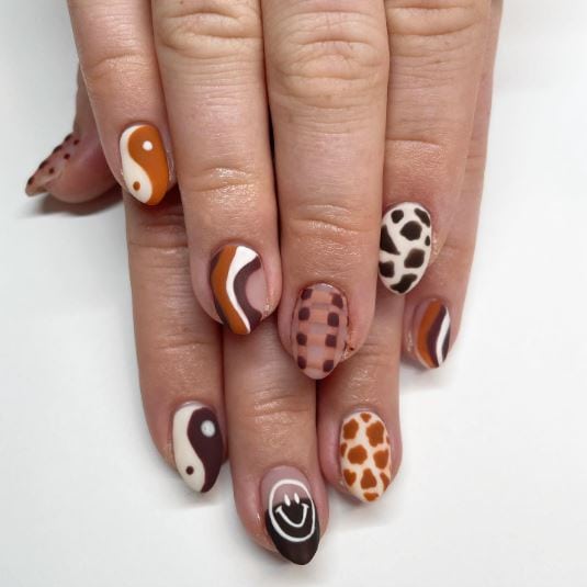 Orange and Brown Cow Print Nails