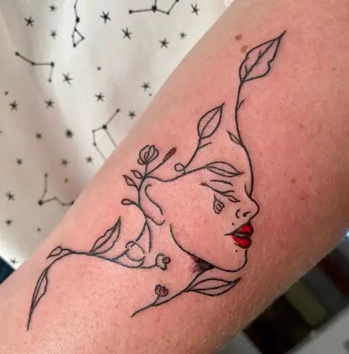 Outline of a Female Face with Stem and Leaves Tattoo
