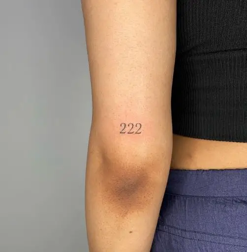 Simple 222 Tattoo on the Upper Elbow