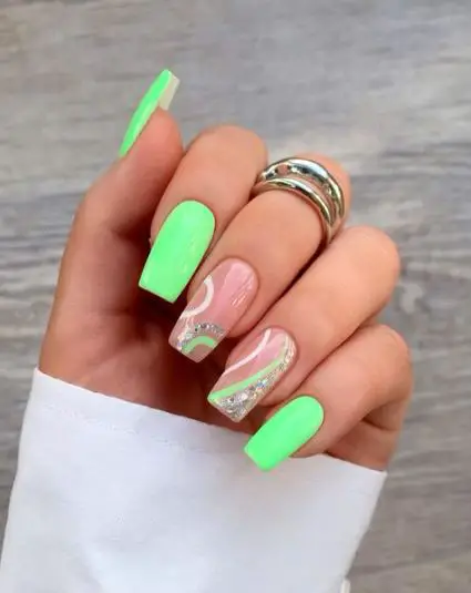 Solid Green Nails with Two Nude Patterned Nails