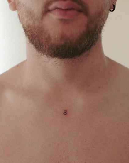 Tiny Number 8 Tattoo On Chest