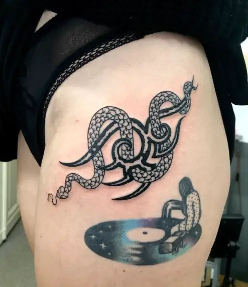 Black Ink Tribal Snake Tattoo on Thigh