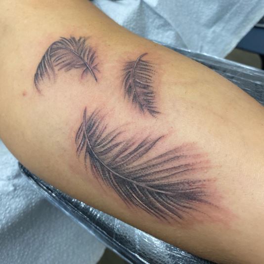 Triple Angel Feathers Tattoo