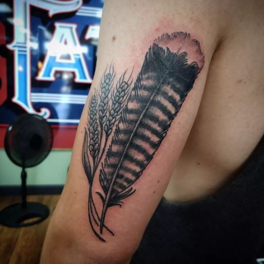 Turkey feather and wheat plant tattoo