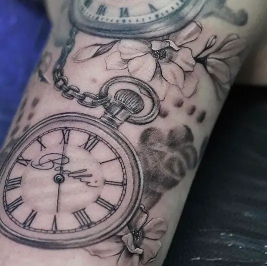 Two Clocks With Flowers and Footprint Tattoo