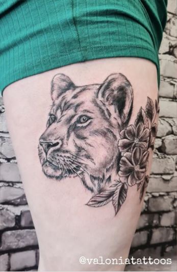 Wild Lioness and Flowers Tattoo