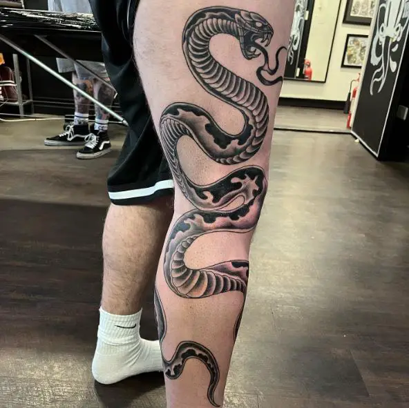 Big snake wrap around tattoo