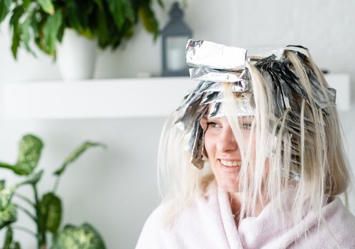 Woman's Hair is Dyed and Ready to Remove