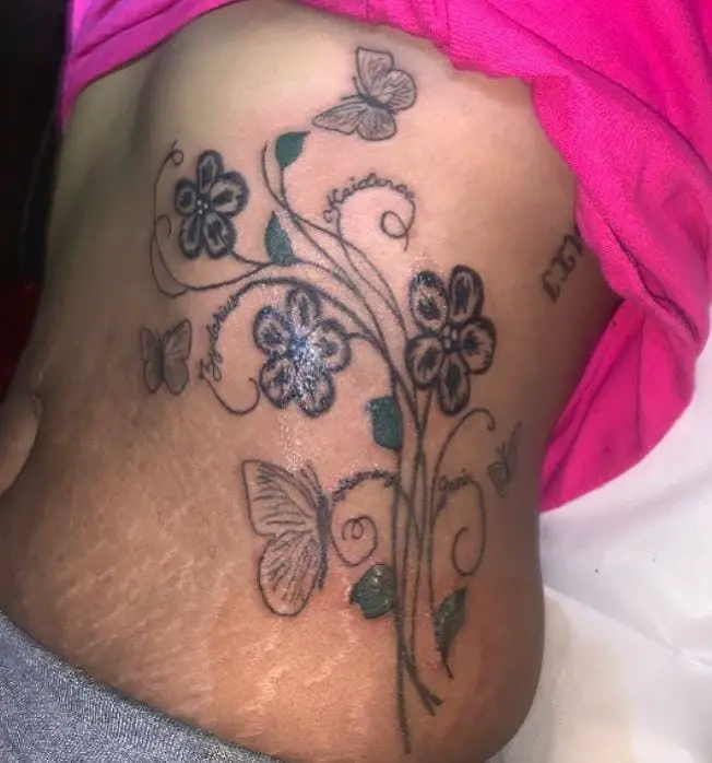big floral tattoo with butterflies and names