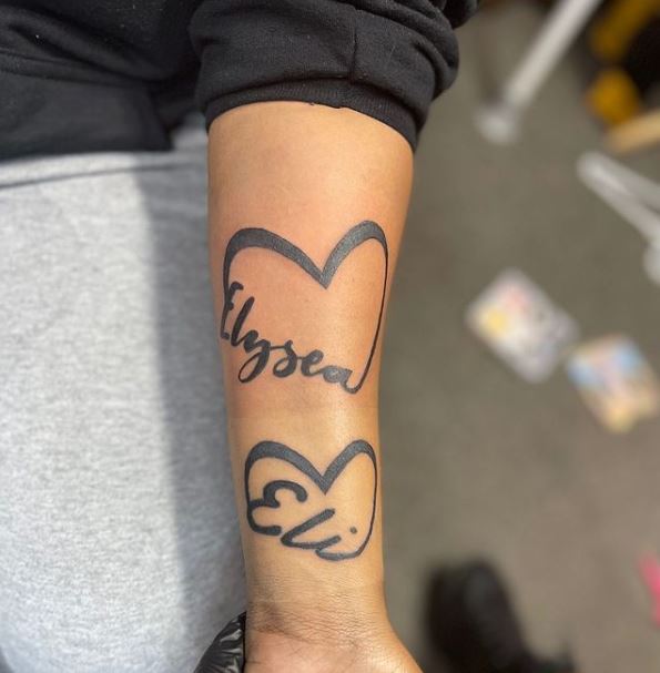 tattoo with 3 names and a heart beat