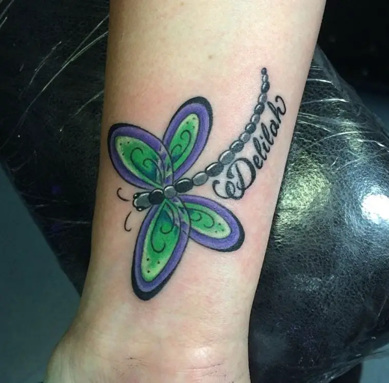 kids name tattoo with a dragonfly