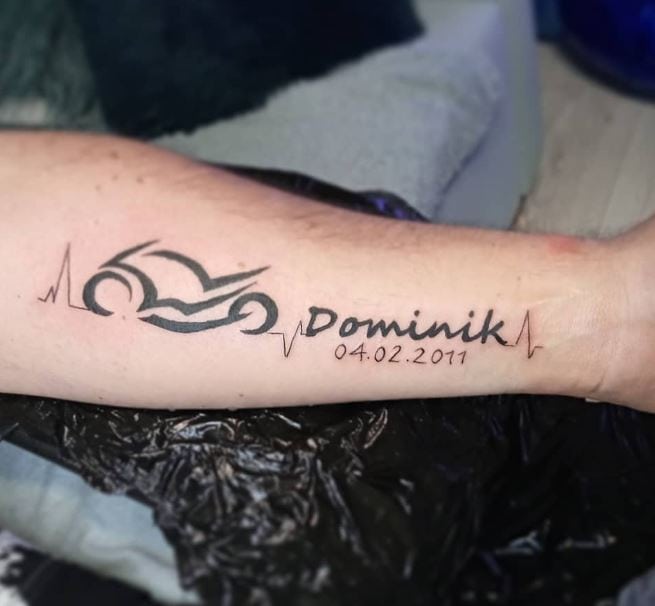 name and date tattoo with motorcycle