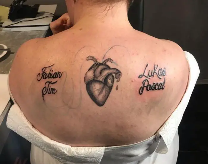 realistic heart and names tattoos