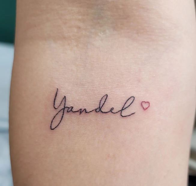 small name tattoo with a heart