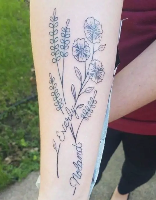 tattoo with bunch of flowers and names