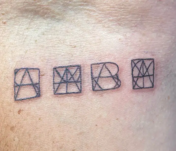 tattoo with letters within boxes