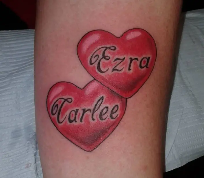 two heart tattoos with names