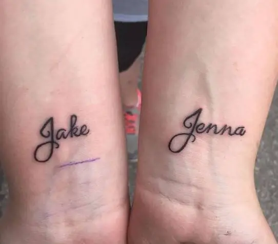 two name tattoos on the two hands
