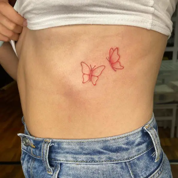 Two Red Small Butterflies Ribs Tattoo