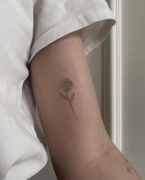 Small Rose Biceps Tattoo