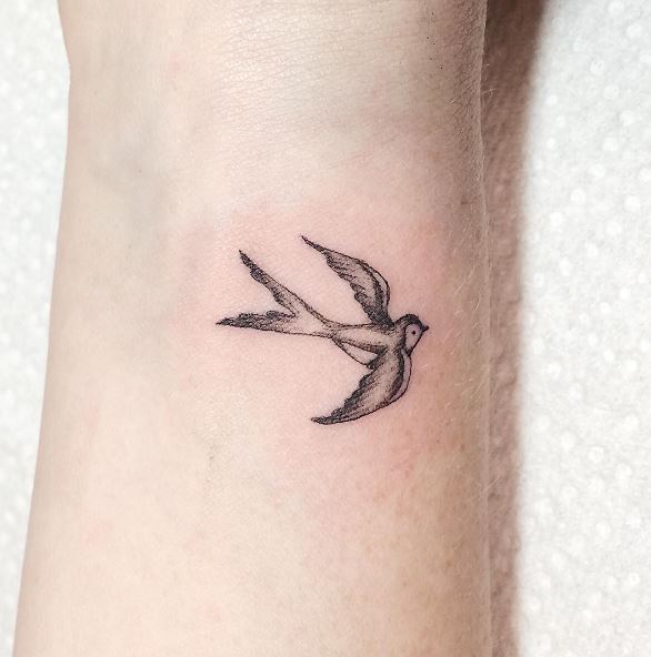 Shaded Sparrow Wrist Tattoo