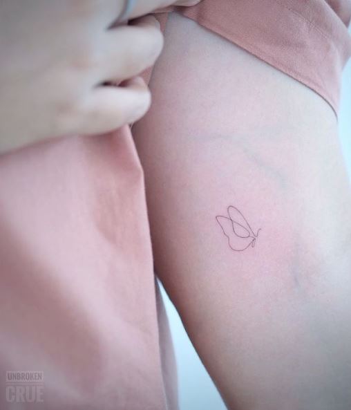 Minimalistic Butterfly Arm Tattoo