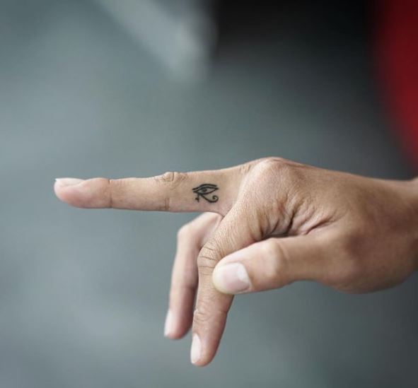 Micro Eye of Horus Finger Tattoo