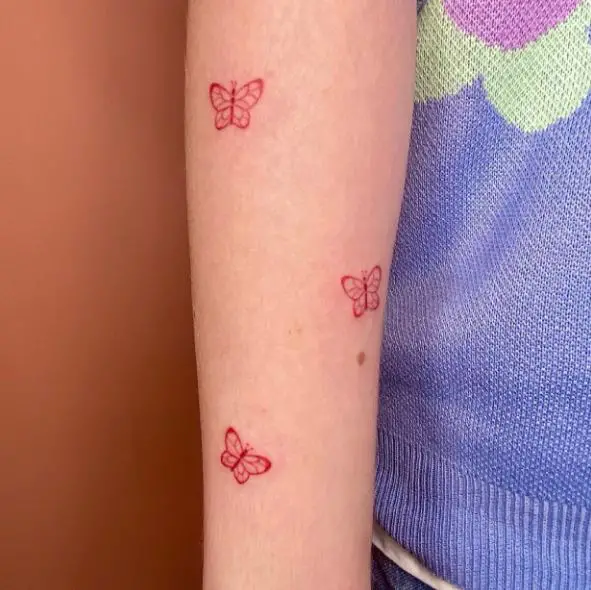 Red Minimalistic Butterflies Arm Tattoo