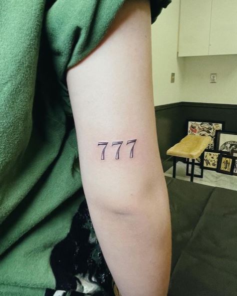 Sketched Minimalistic 777 Elbow Tattoo