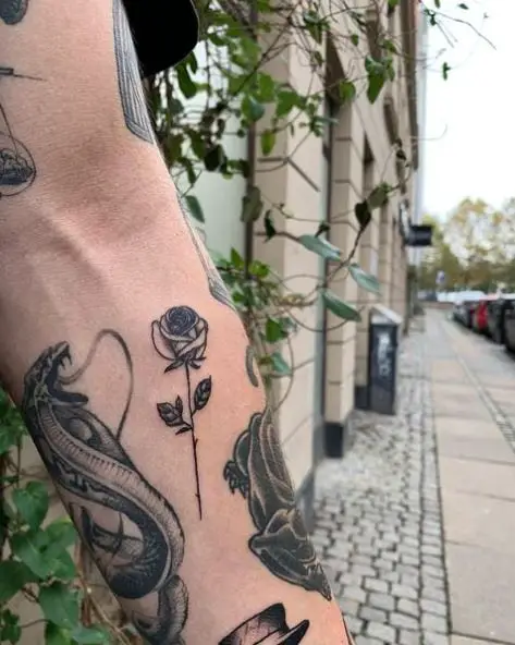 Black Inked Forearm Rose Tattoo