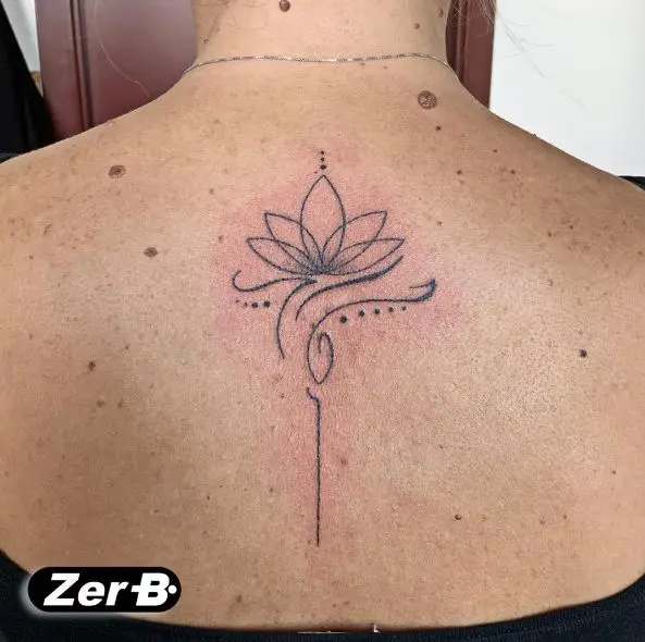 Grey Lotus Flower Spine Tattoo