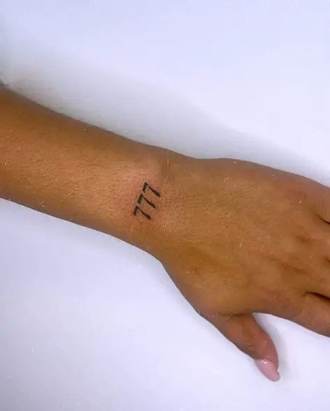 Minimalistic 777 Wrist Tattoo