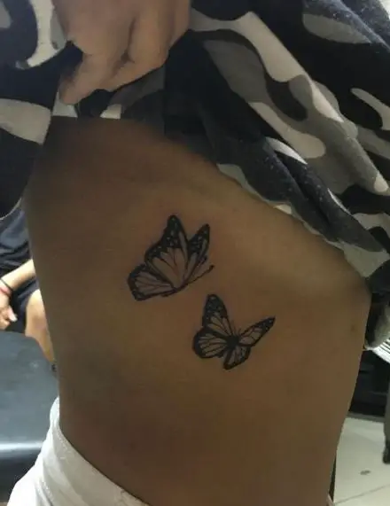 Two Butterflies Ribs Tattoo
