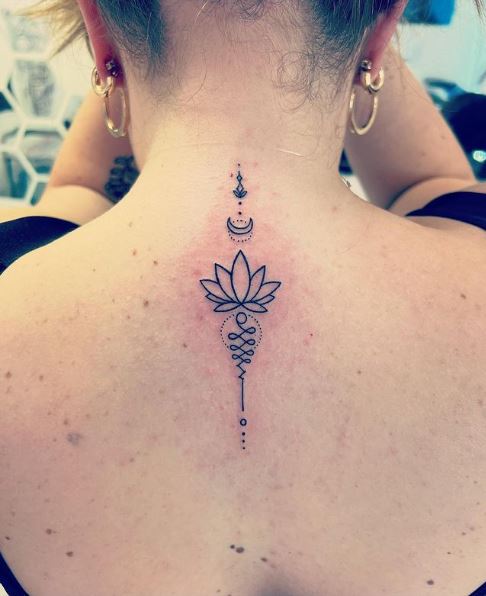 Half Moon and Lotus Flower Spine Tattoo