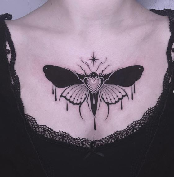 Black and White Moth Chest Tattoo