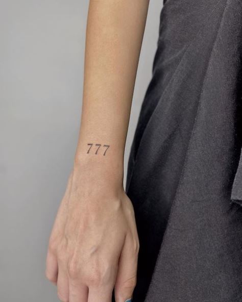 Minimalistic Thin 777 Wrist Tattoo