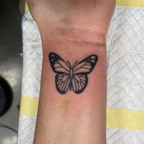 Black Butterfly Wrist Tattoo