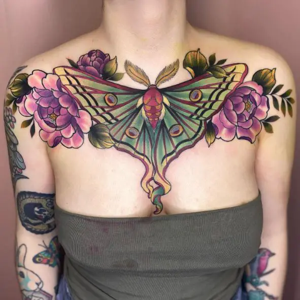 Violet Flowers and Colorful Moth Chest Tattoo