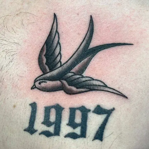 Black and Grey Swallow Tattoo with Year