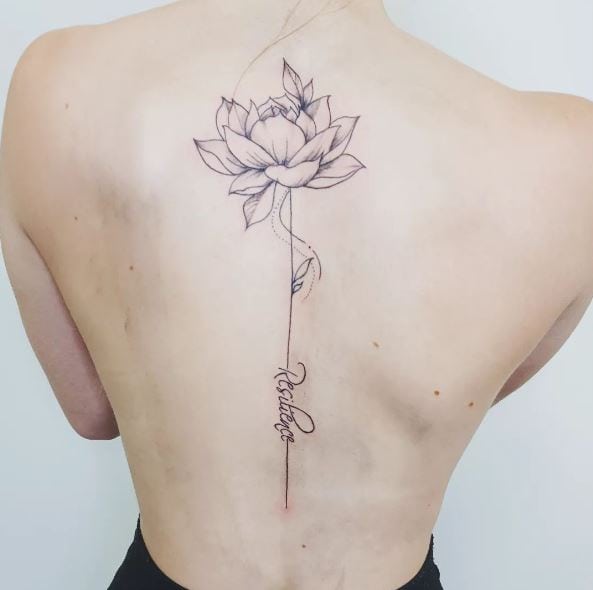 Lettering and Lotus Flower Spine Tattoo