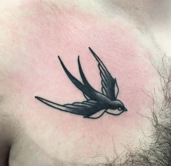 Little Black Swallow Chest Tattoo