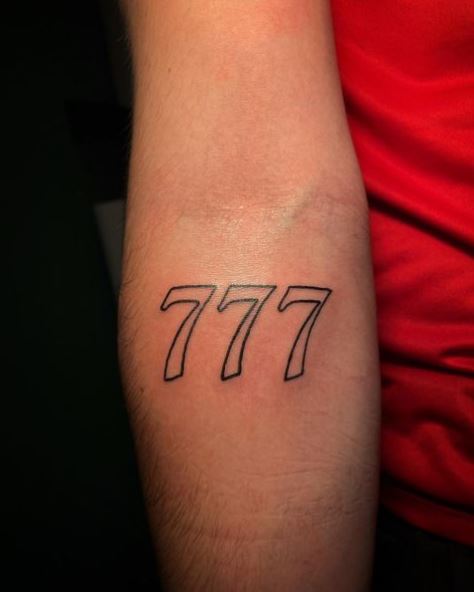 Black and White 777 Forearm Tattoo