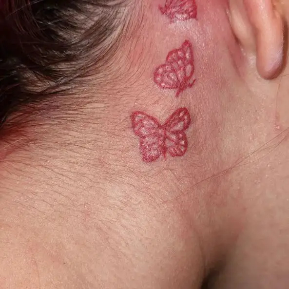 Three Red Butterflies behind Ear Tattoo