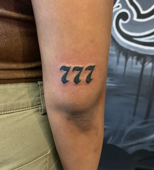 Black and Grey Minimalistic 777 Elbow Tattoo