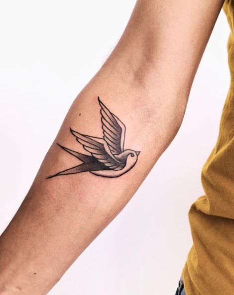 Grey and White Flying Swallow Forearm Tattoo