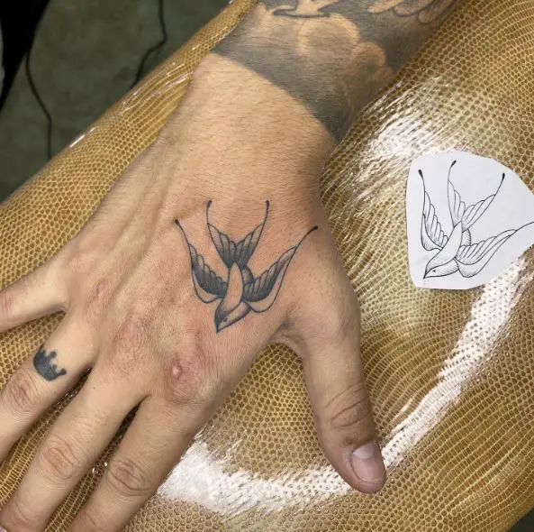 Shaded Small Swallow Hand Tattoo